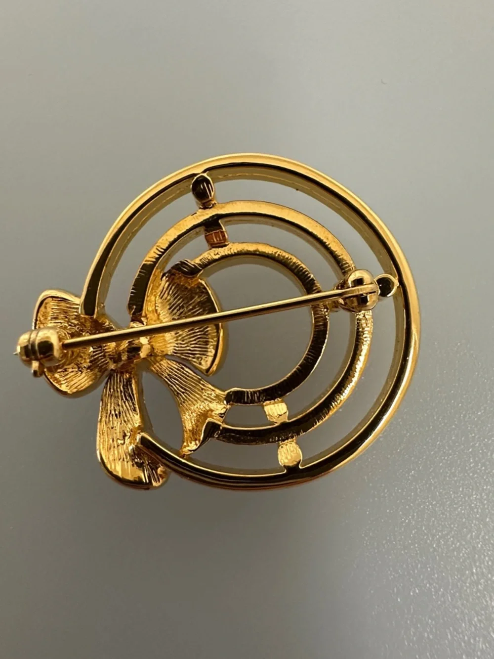 Gold-Tone Brooch with Red Enamel Bow and Crystal Accent